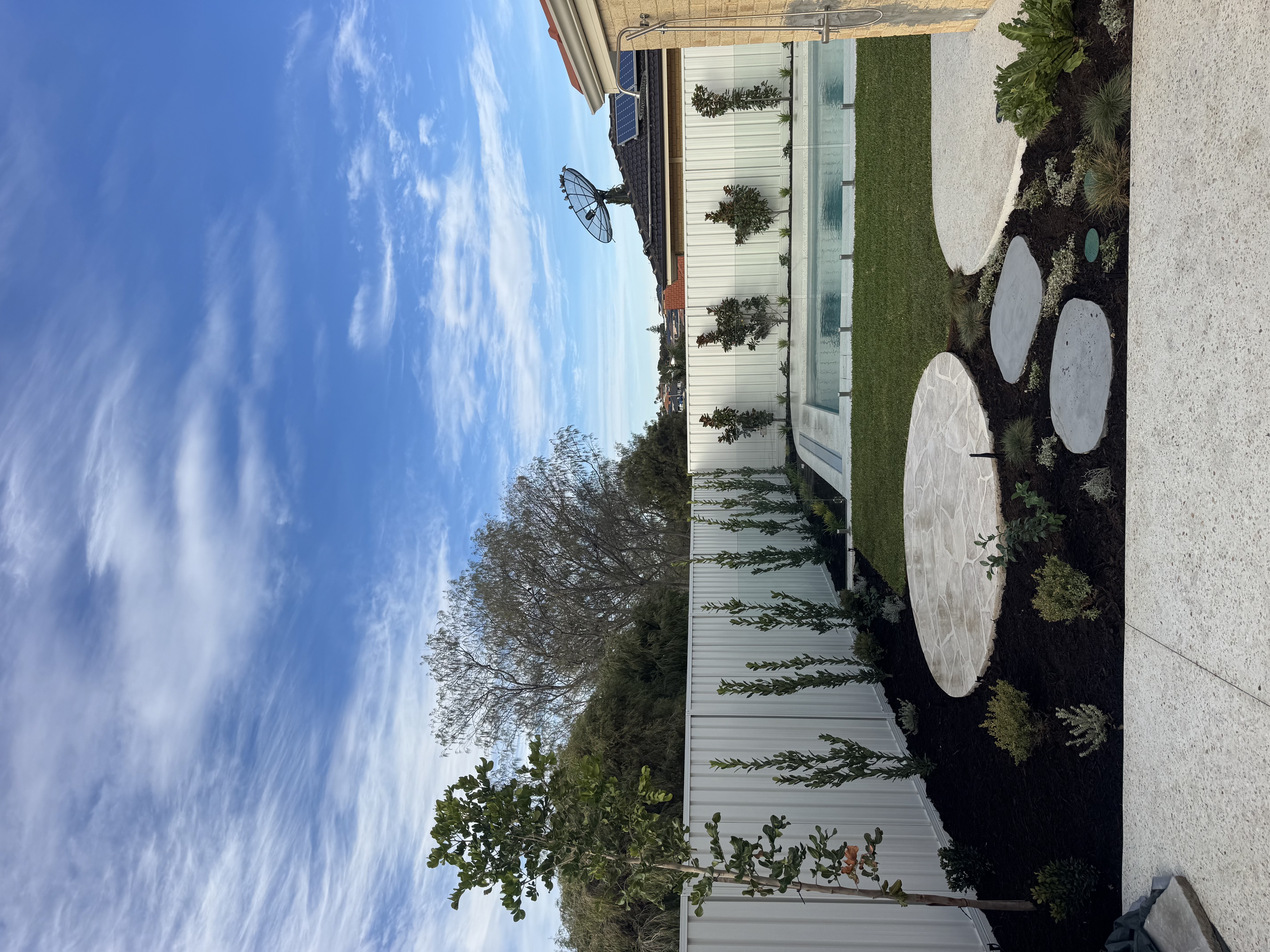 Completed coastal landscape project featuring outdoor entertaining and native planting in Perth